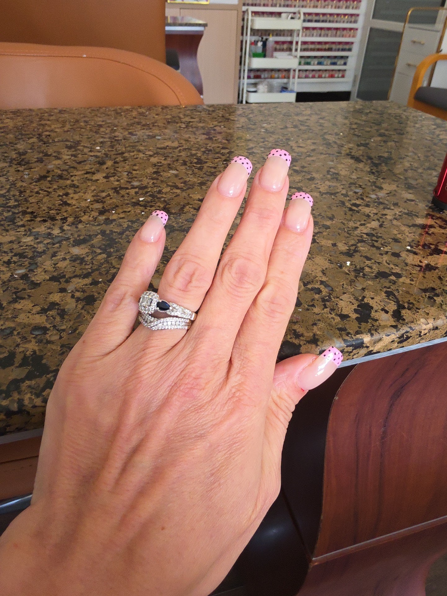 Pink French tips with black polka dots